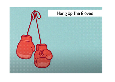 The meaning of the boxing term To Hang up the Gloves is explained and illustrated.