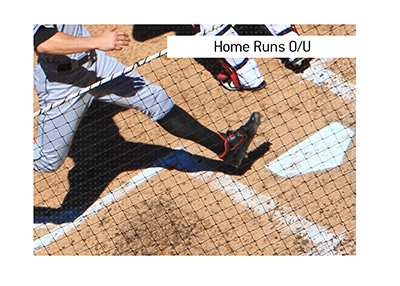 The King explains the meaning of the baseball betting term Home Runs Over / Under.  In photo: Baseball player getting to the 4th base.