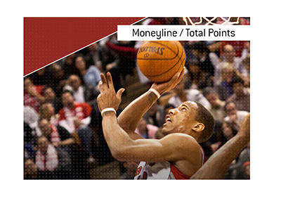 In photo:  Toronto Raptors player trying to score a basket.  The meaning of the betting term Moneyline / Total Points is explained.