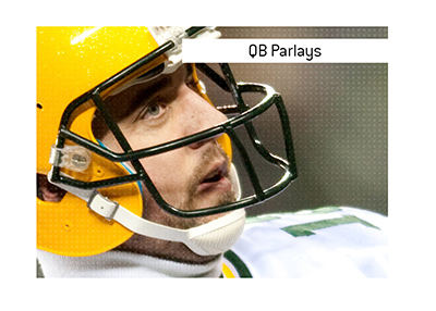 In photo: Aaron Rodgers playing for the Packers.  The meaning of the betting term QB parlay is explained.