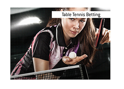 Table Tennis is a popular betting sport.  In photo:  A young woman serving the ball.