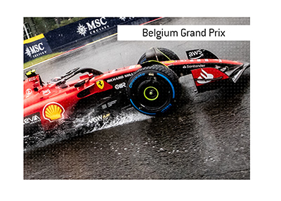 A Ferrari driver taking a sharp corner in the rain at the Belgium Grand Prix.